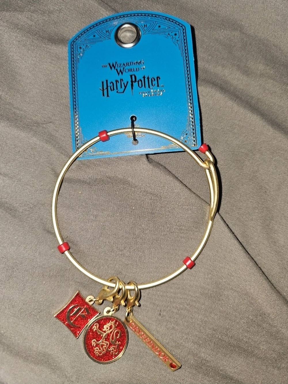 Warner Bros. Gryffindor Gold-Tone Bracelet with Red Enamel Charms
